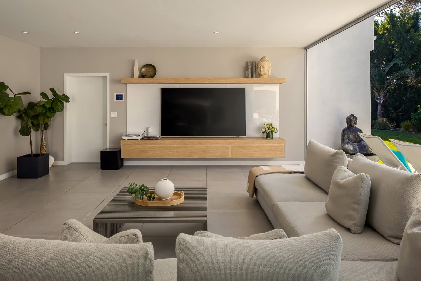 Modern living room with large TV.