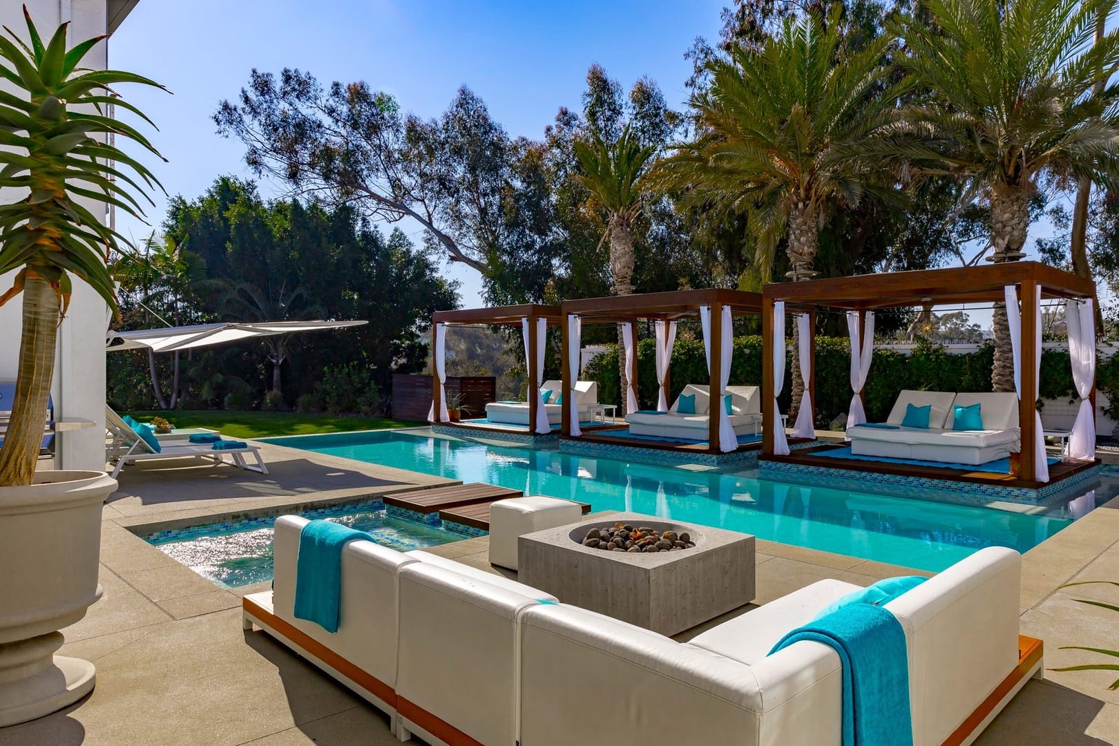 Luxurious outdoor pool with cabanas.