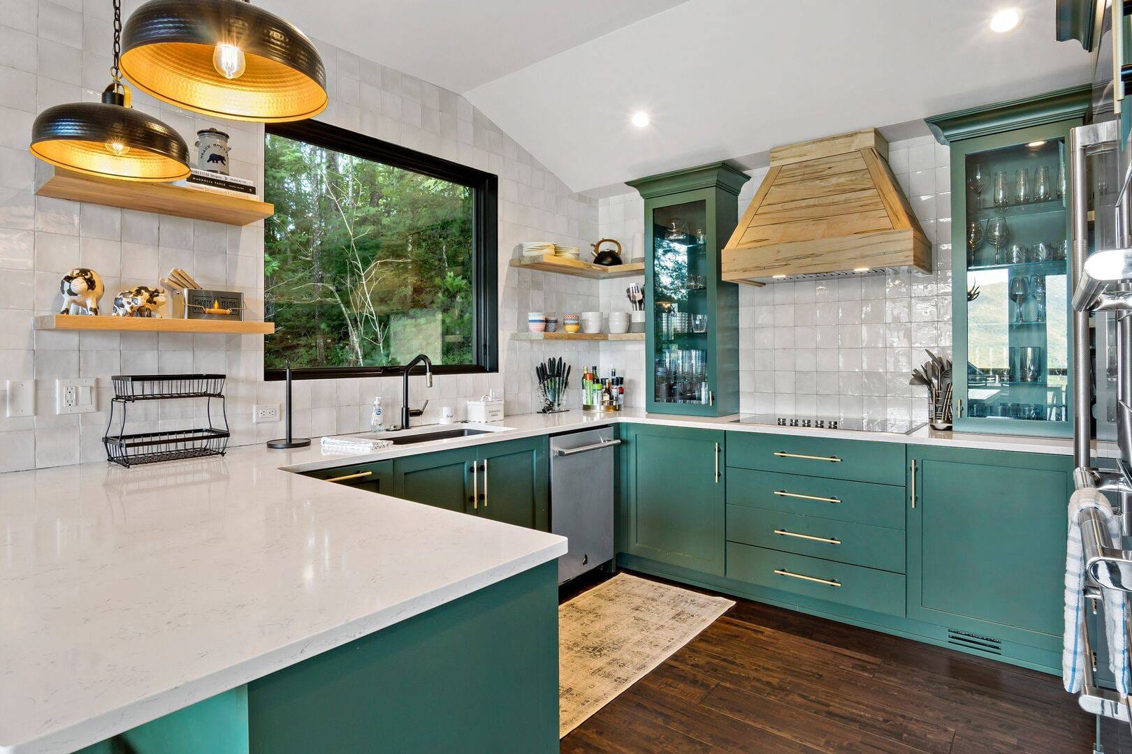 Modern kitchen with green cabinets