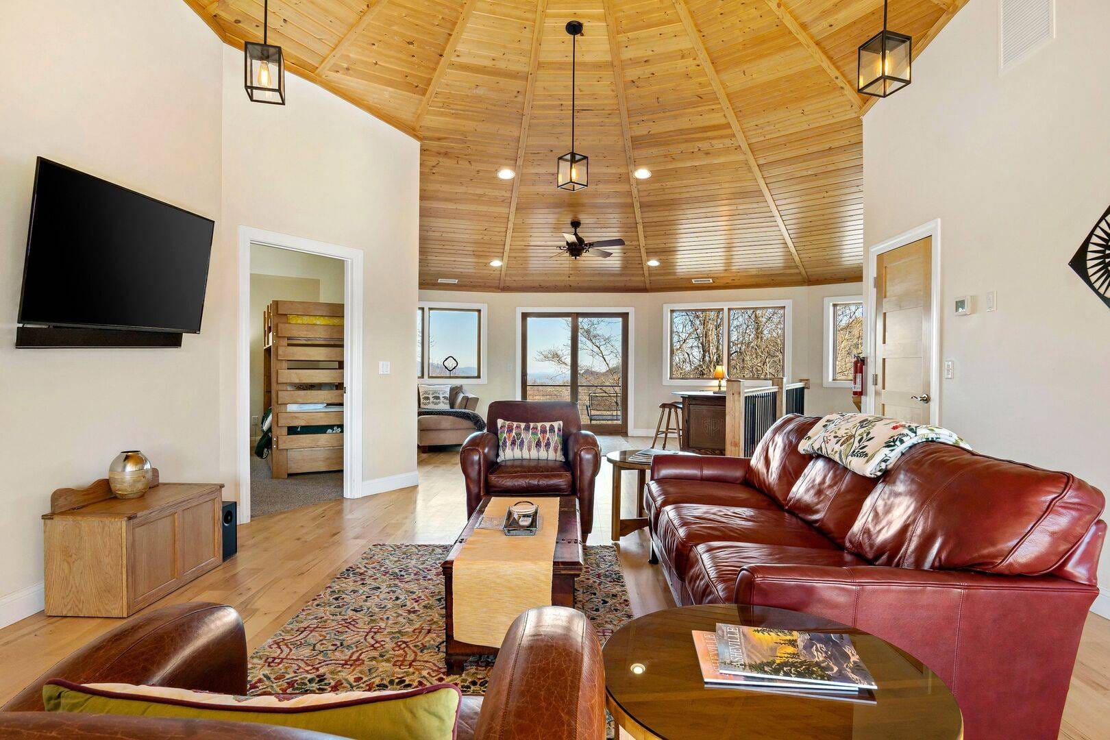 Cozy living room with wooden ceiling.