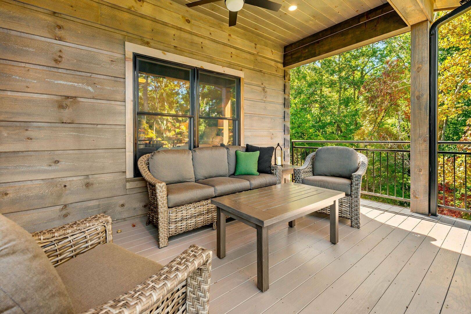 Cozy outdoor porch with furniture.