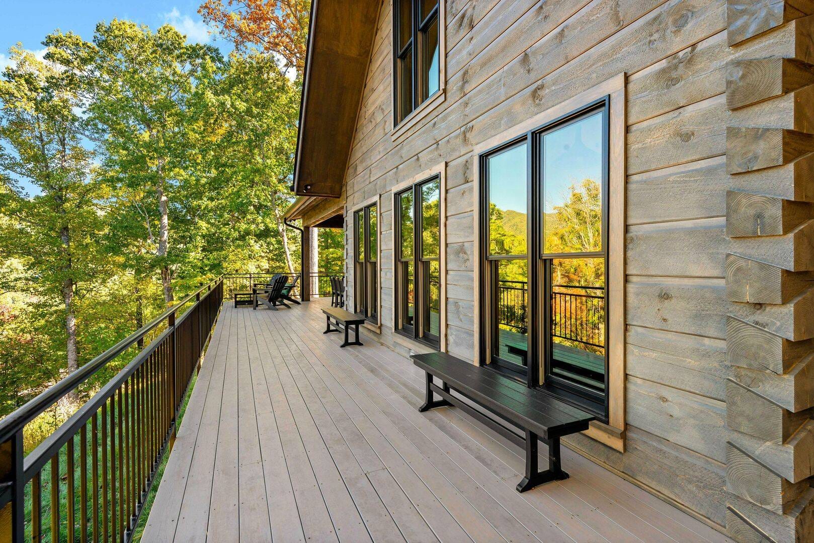 Spacious wooden deck with benches.