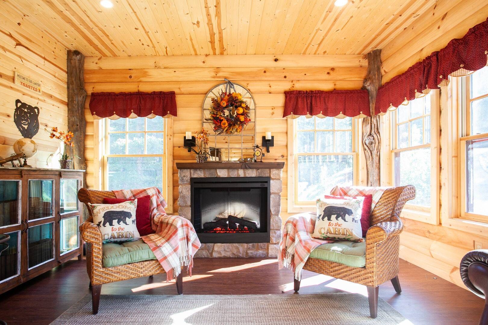 Cozy cabin living room with fireplace.