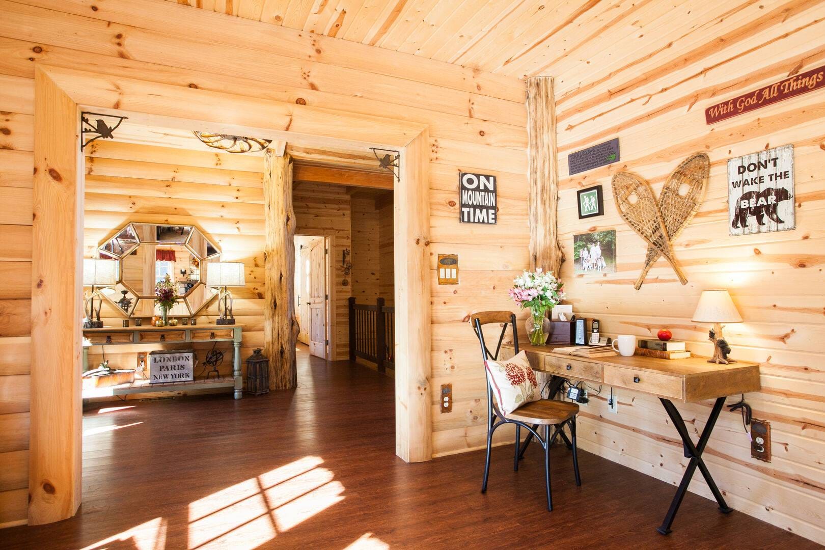 Cozy cabin interior with desk.