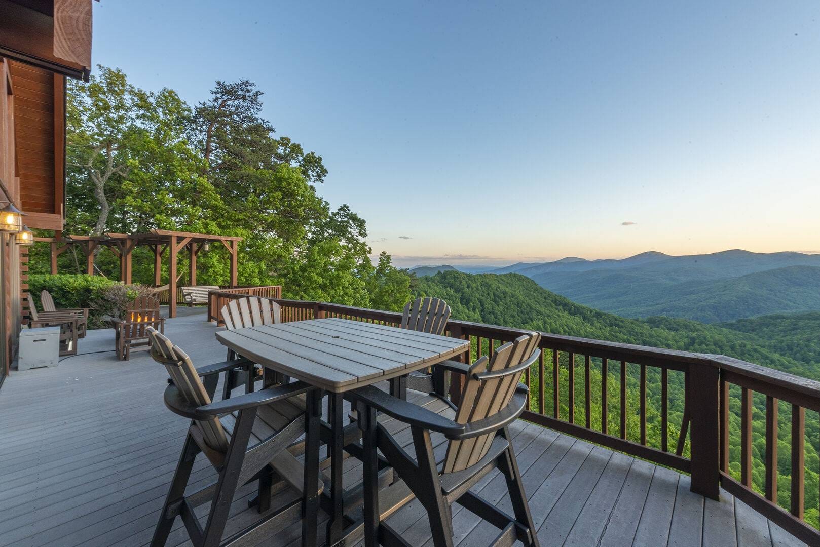 Deck with mountain view at sunset.