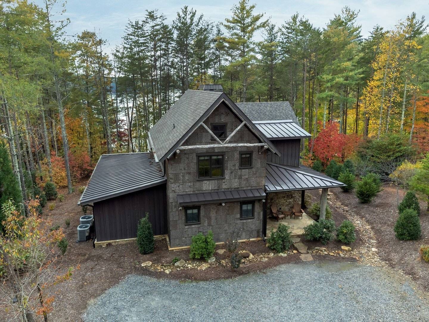 Wooden house surrounded by trees.