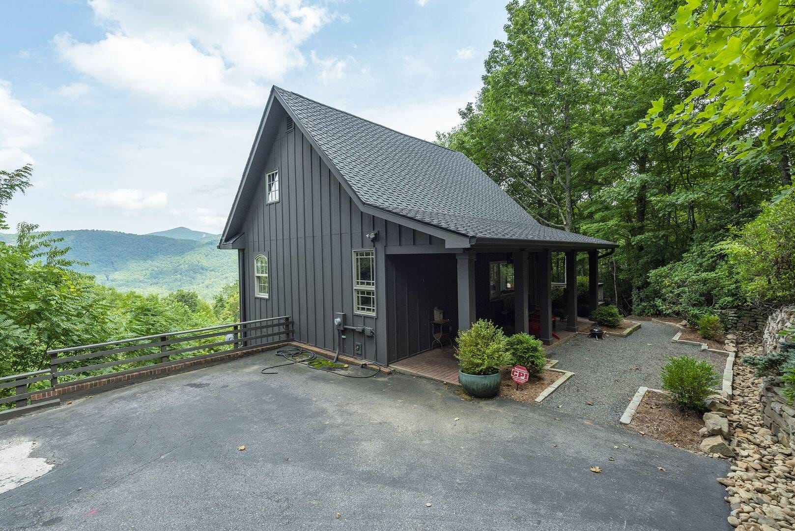 Gray house with mountain view.