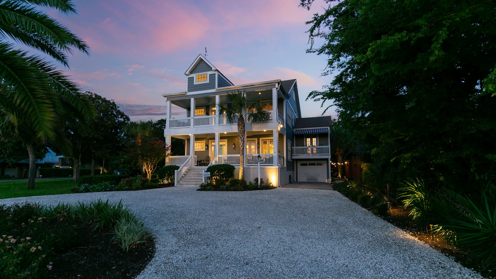 Two-story house with sunset sky