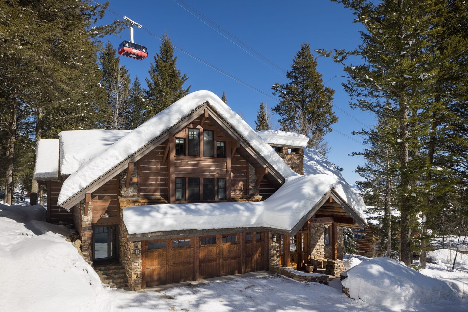 Snow-covered cabin with cable car.