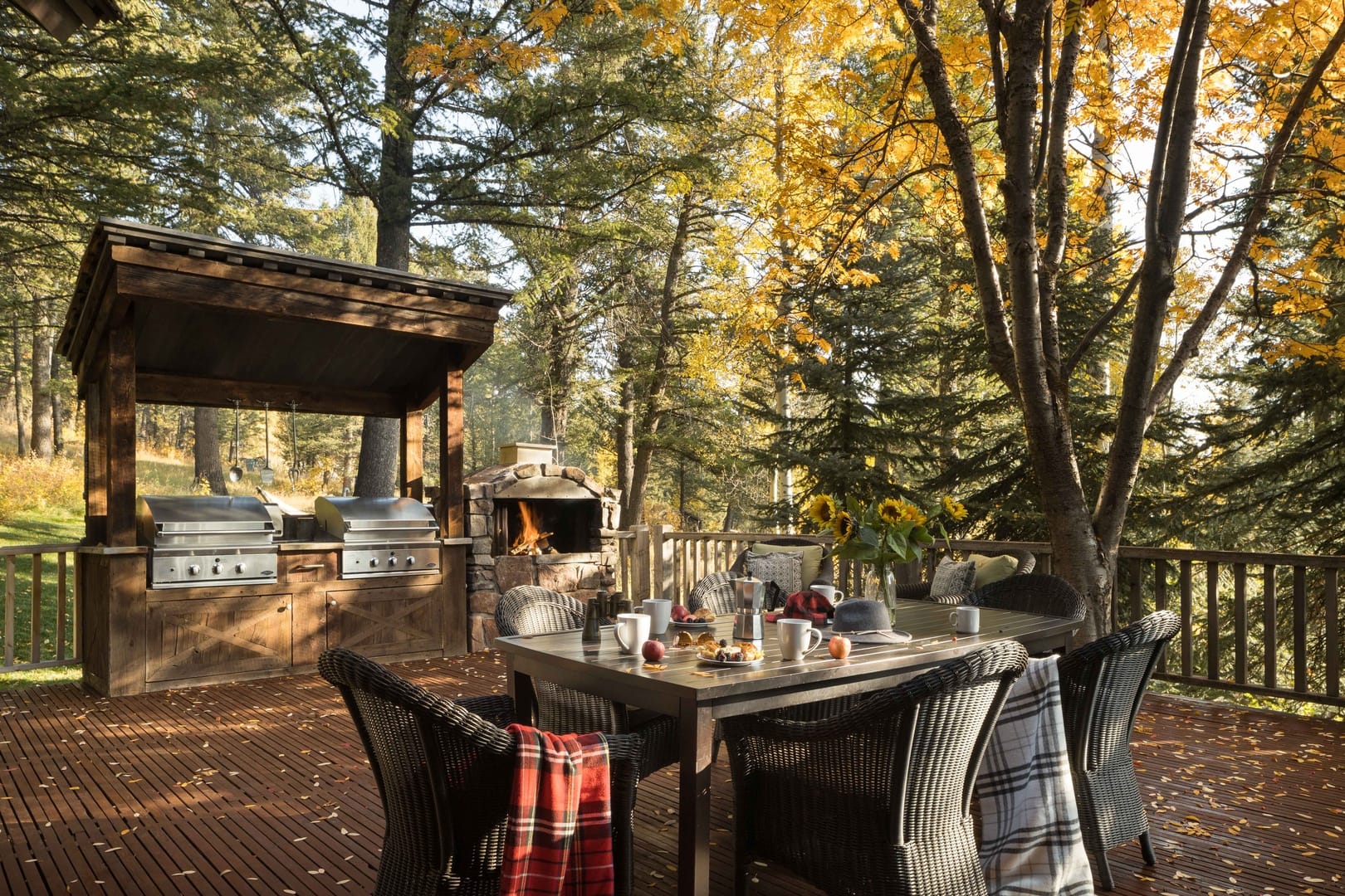 Outdoor patio with grill and fireplace.