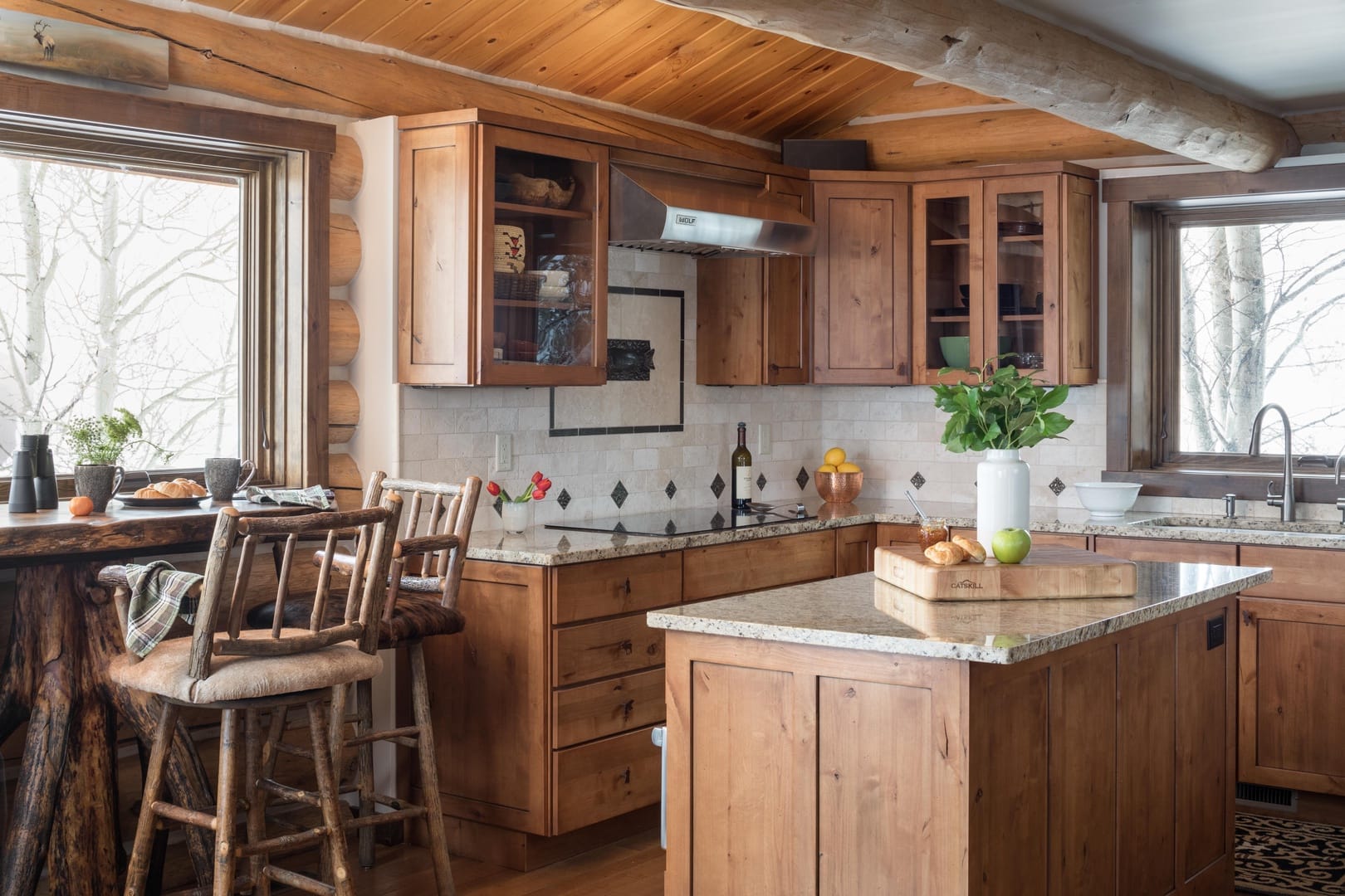 Rustic wooden kitchen with island.