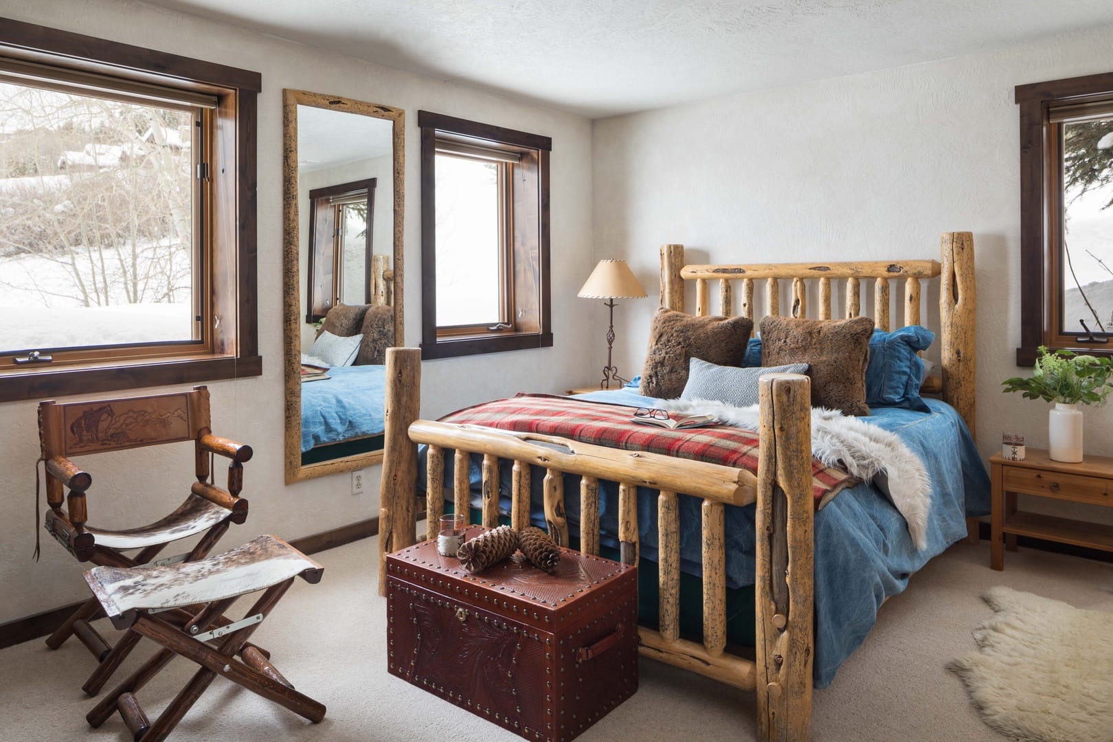 Rustic bedroom with wooden furniture.