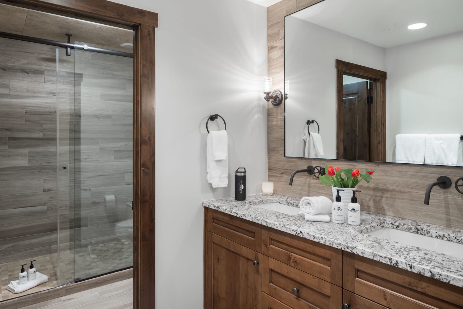 Modern bathroom with wooden accents.