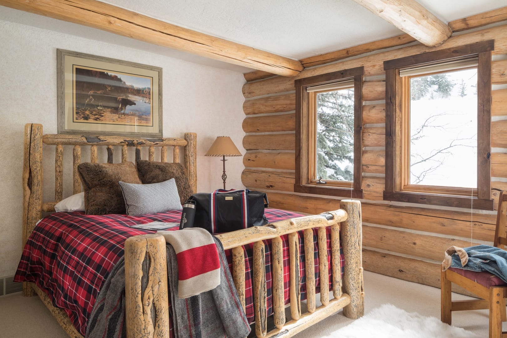 Rustic bedroom with log bed.