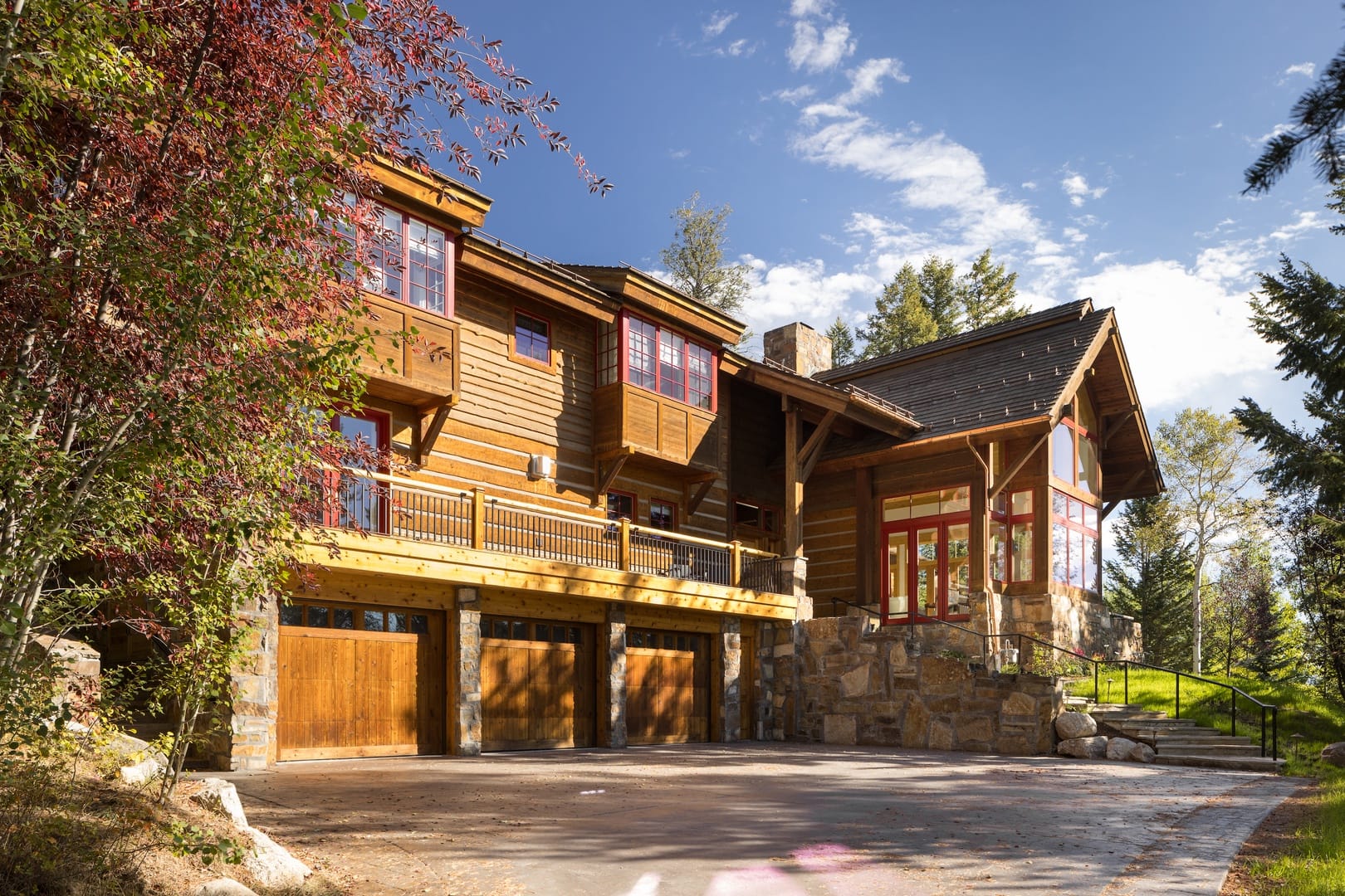 Large wooden cabin with trees.