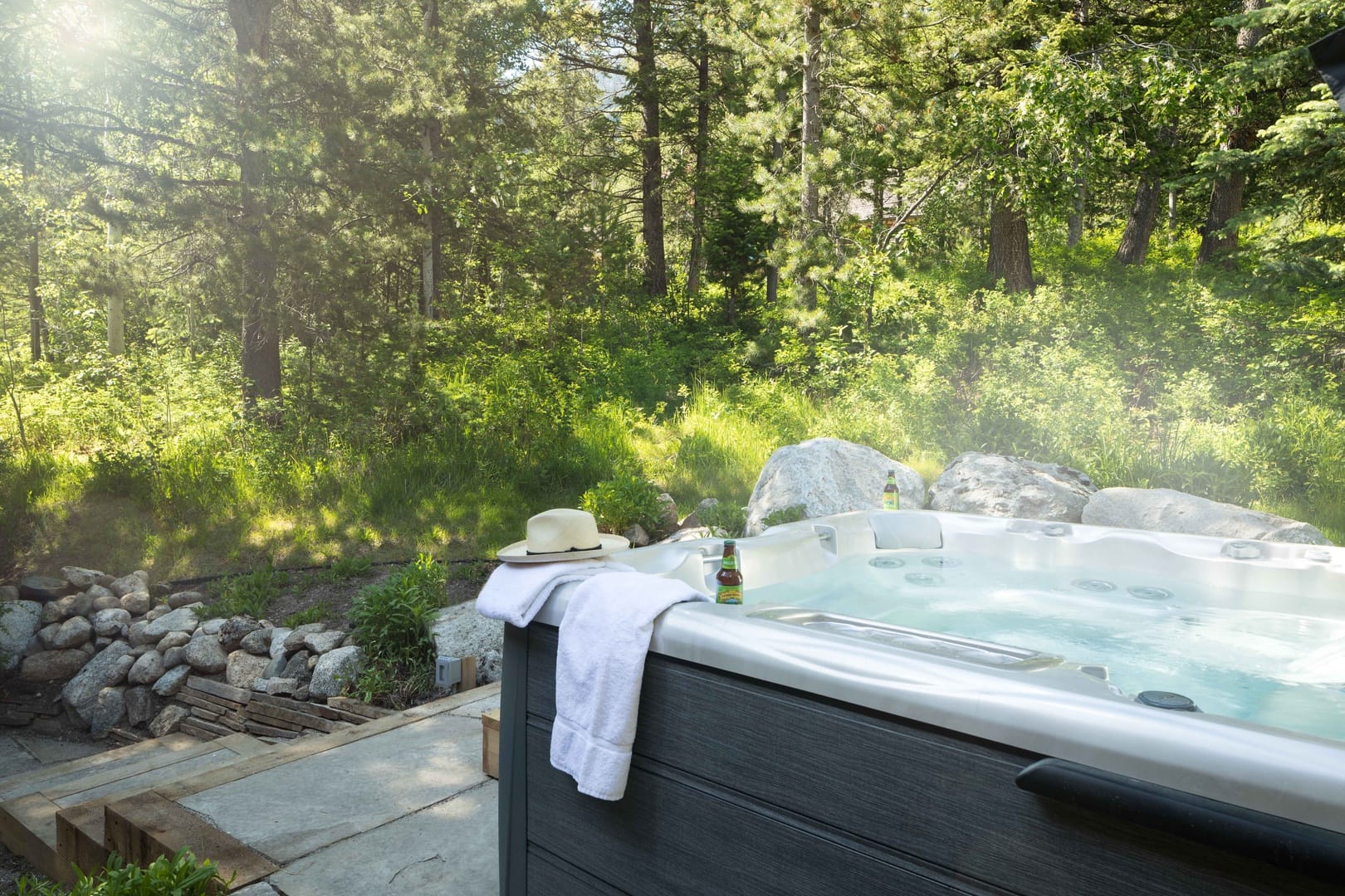 Hot tub in forest setting.