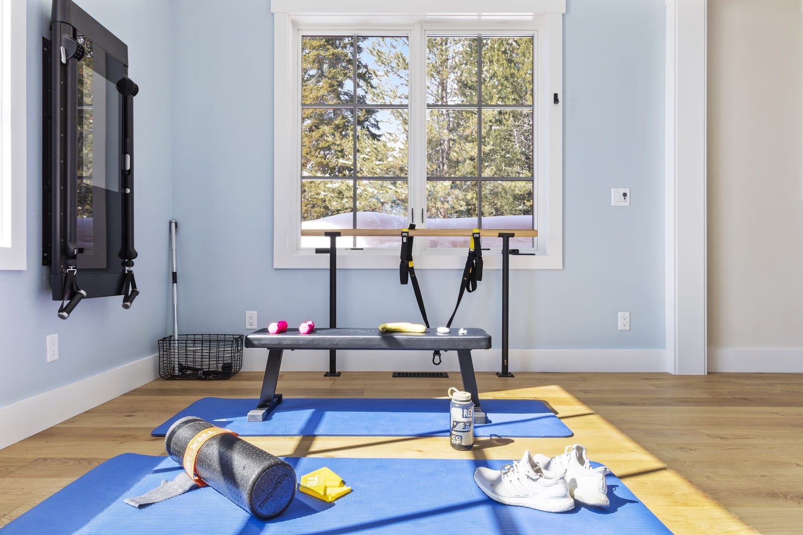 Bright home gym with fitness equipment.