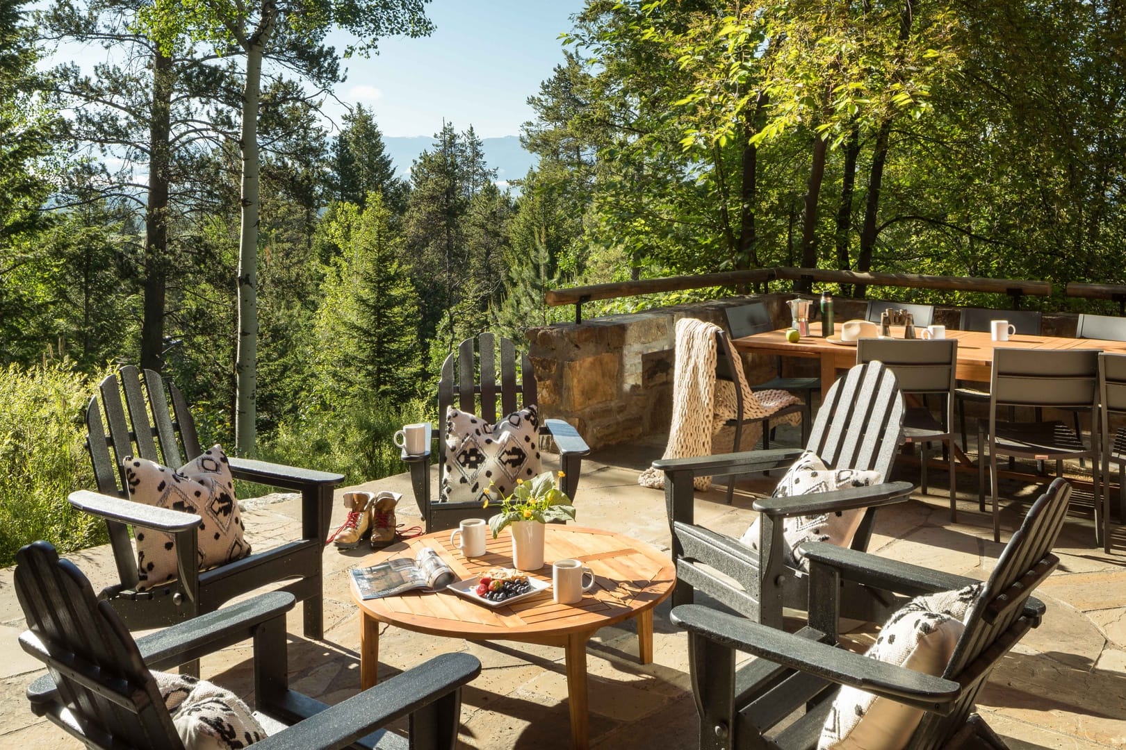 Forest patio with chairs and table.