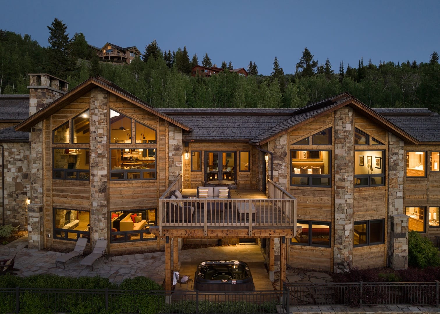 Modern cabin with deck and jacuzzi.