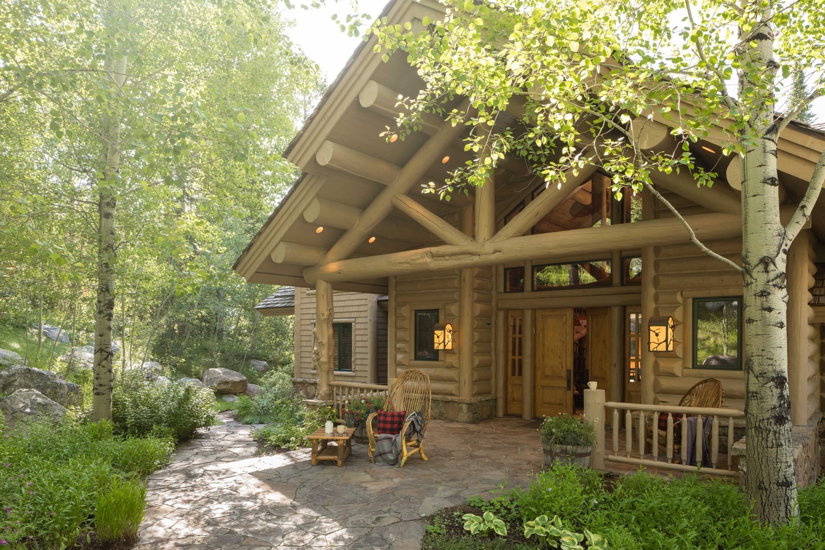 Cozy log cabin surrounded by trees.