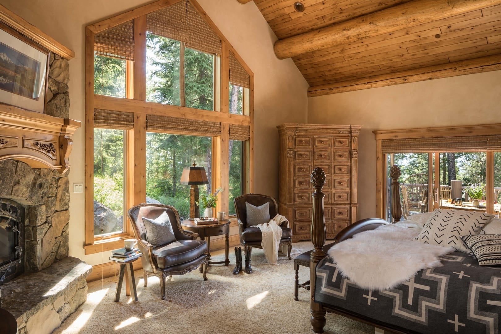 Rustic bedroom with large windows.