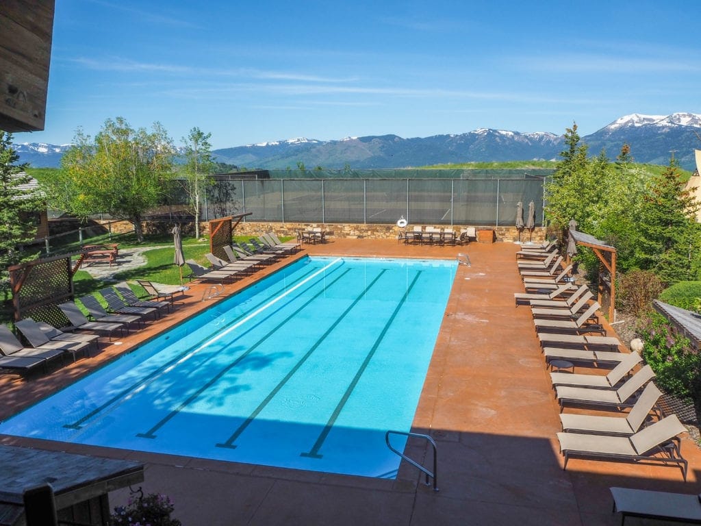 Outdoor pool with lounge chairs.