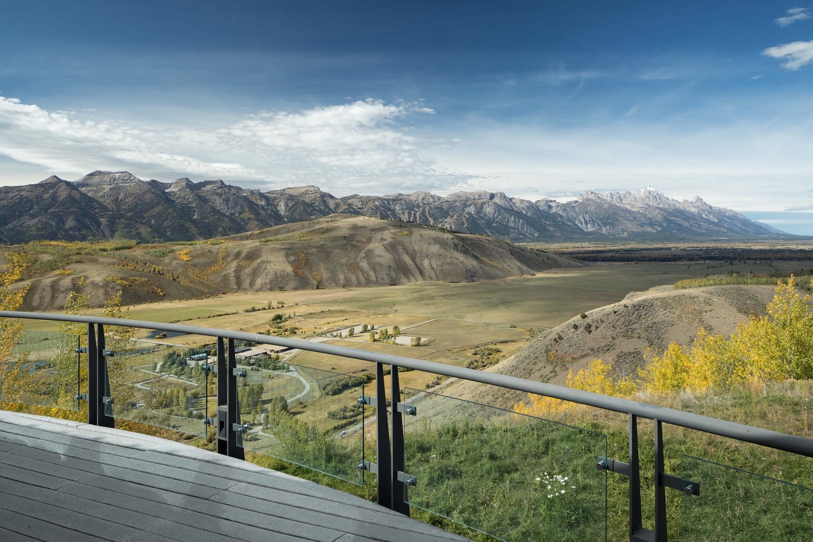 Deck view of mountainous landscape.