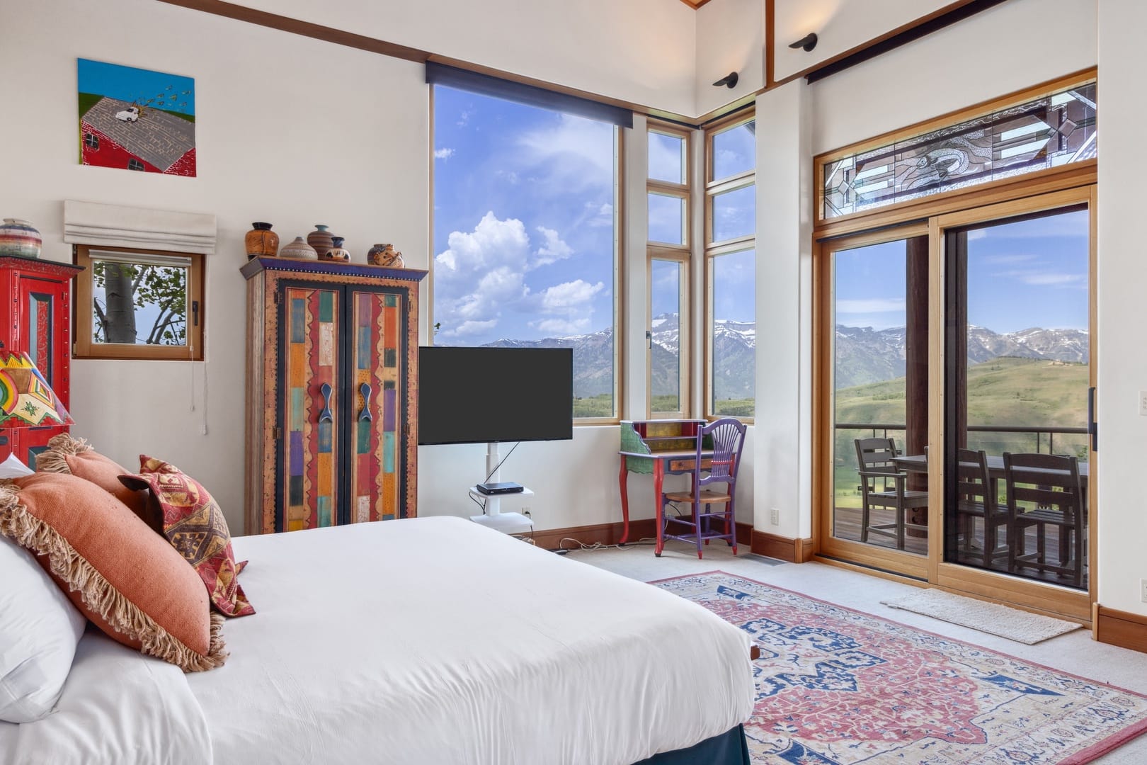 Bedroom with mountain view balcony.