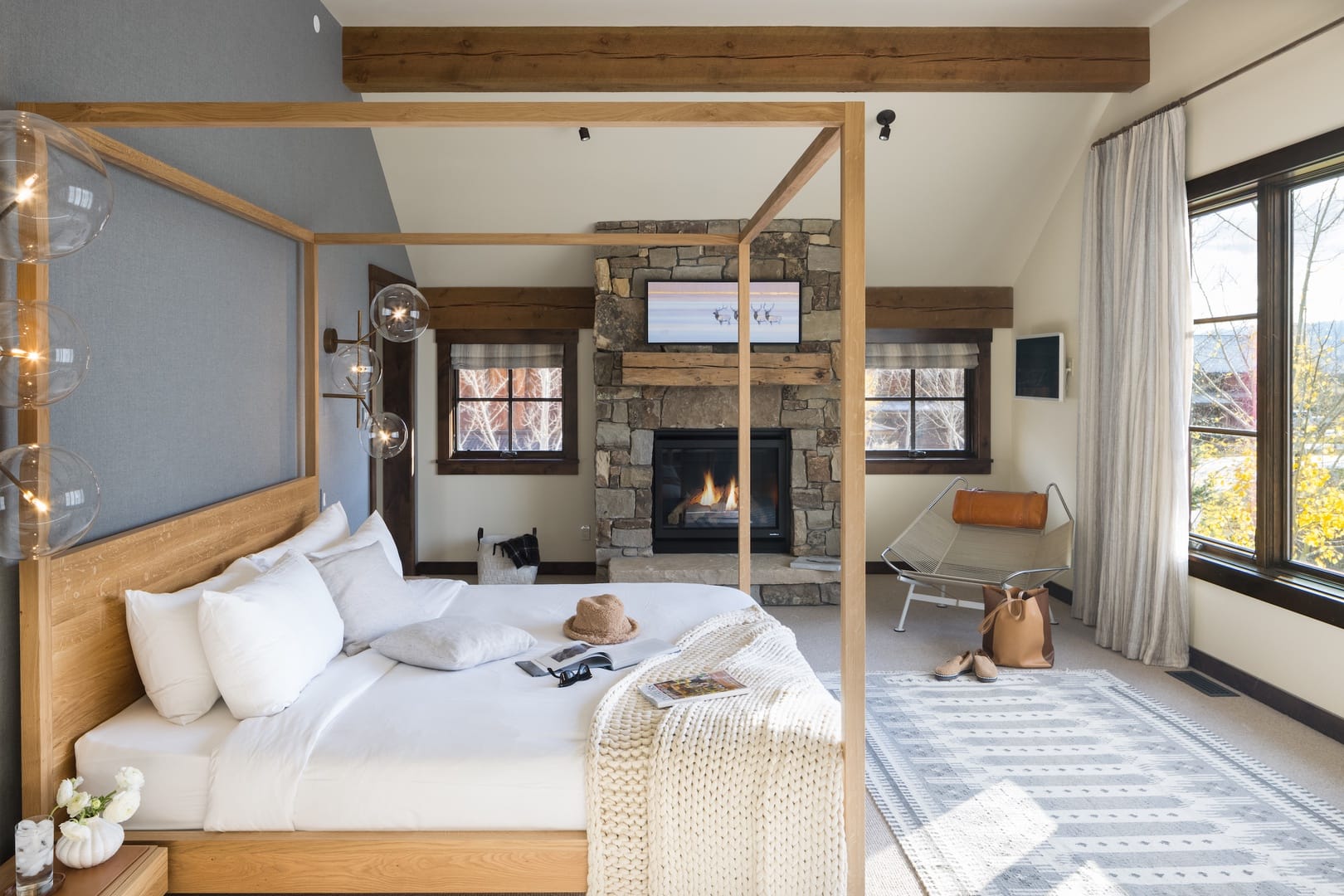 Cozy bedroom with fireplace and window.