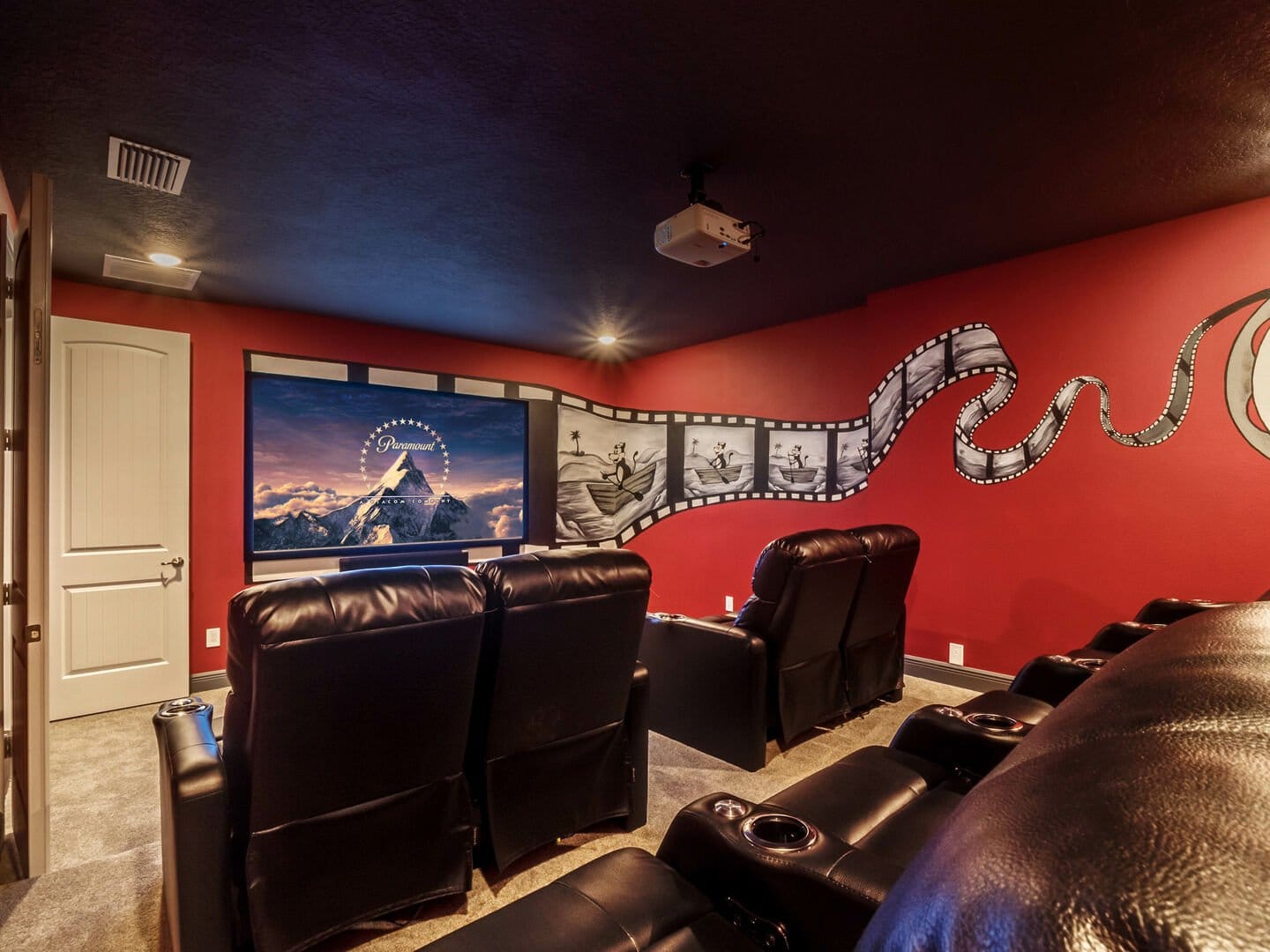 Home theater with leather recliners.