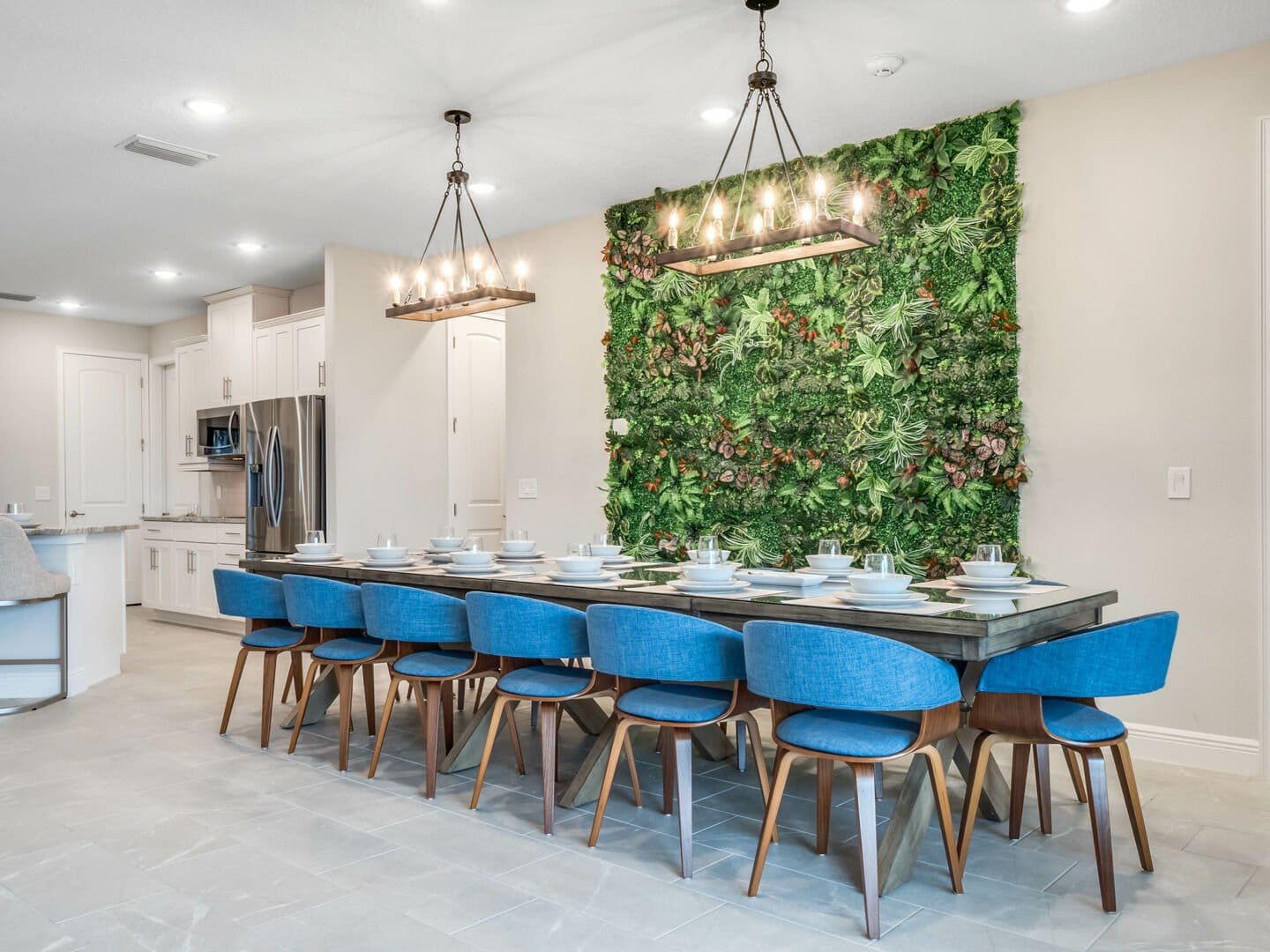 Modern dining area with green wall.