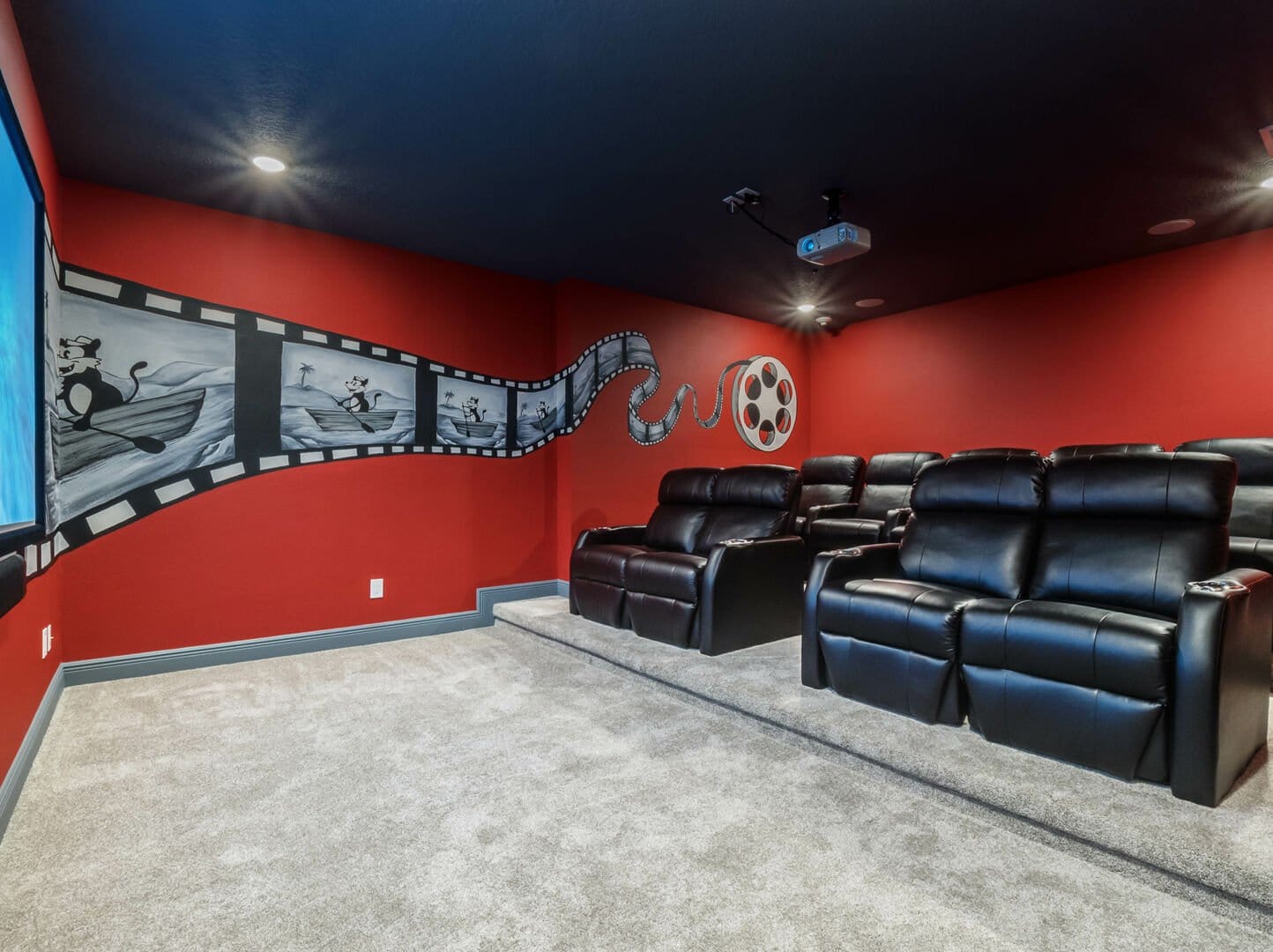 Home theater with red walls.