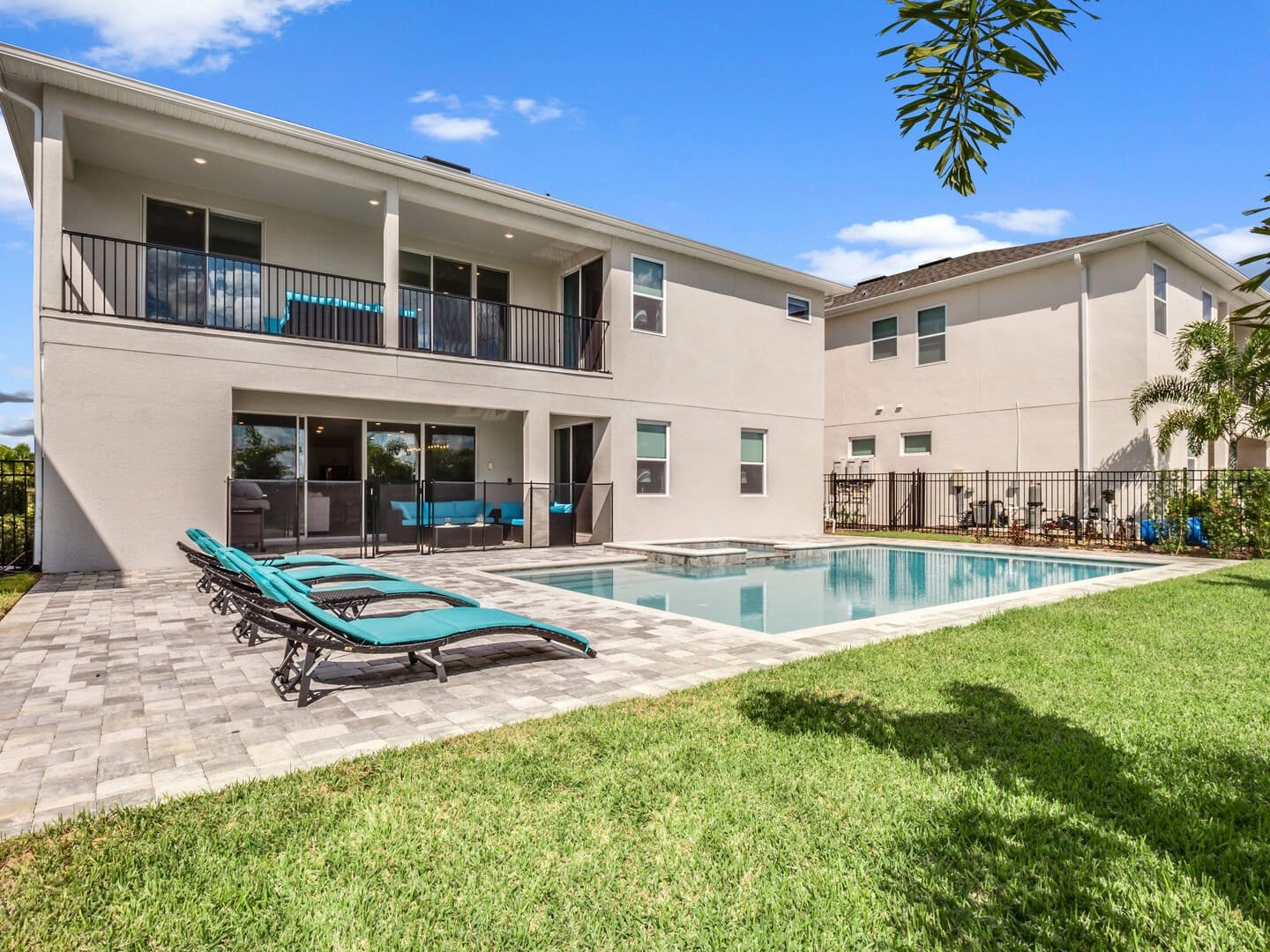 Two-story house with backyard pool.