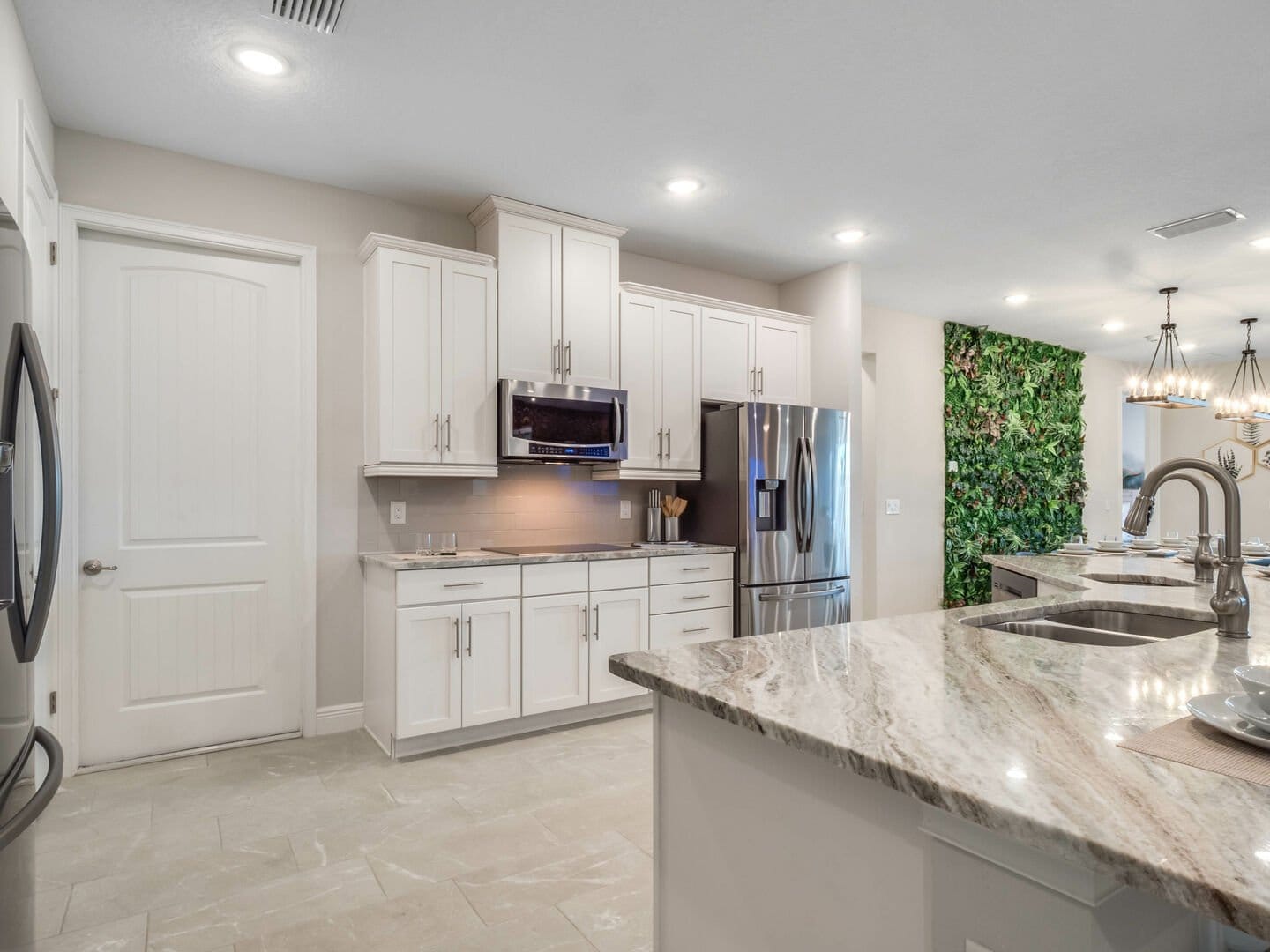 Modern kitchen with marble countertops.