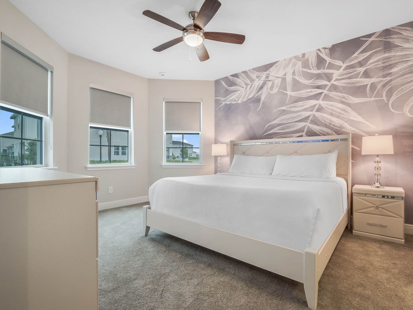 Modern bedroom with white bed.