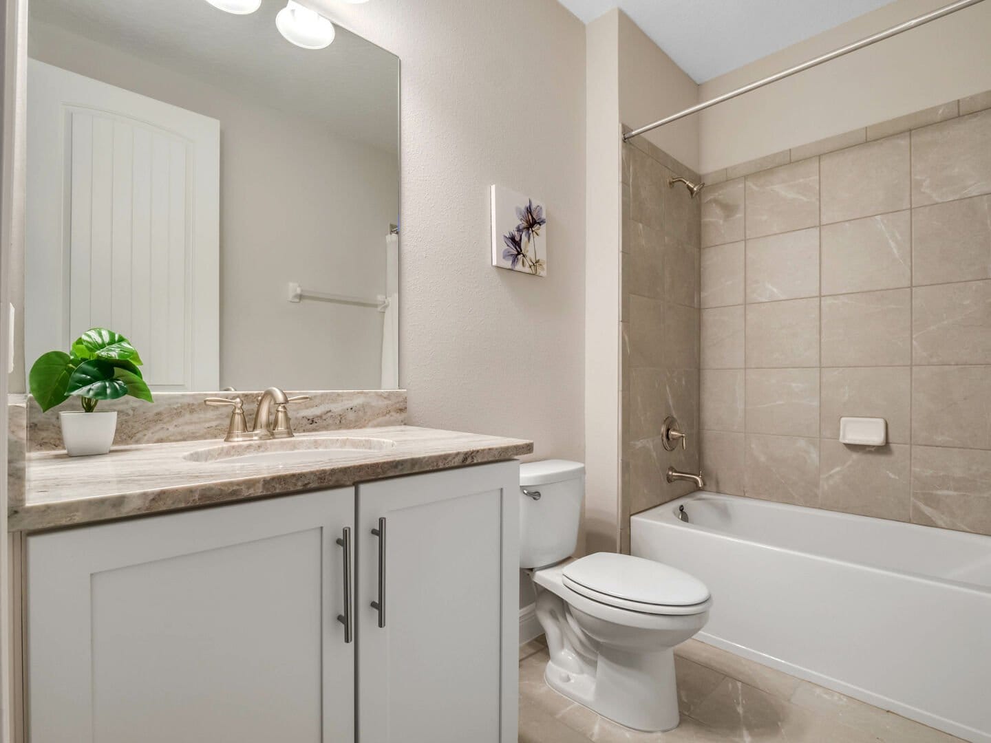 Modern bathroom with white fixtures.