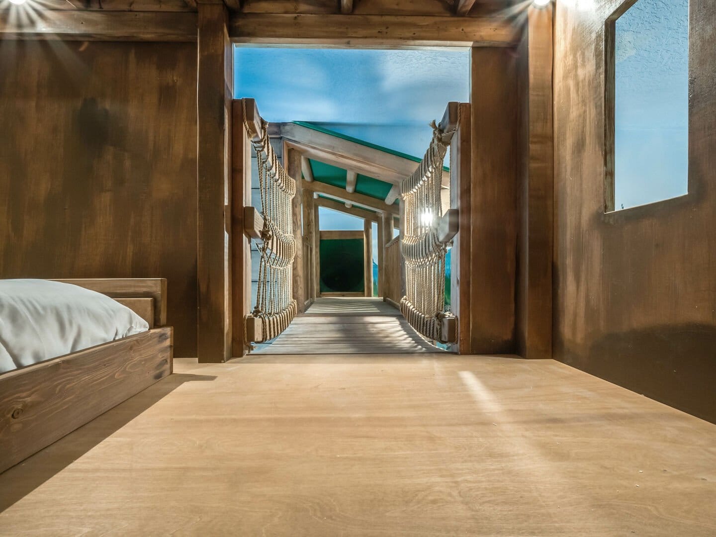 Wooden bridge inside rustic cabin.