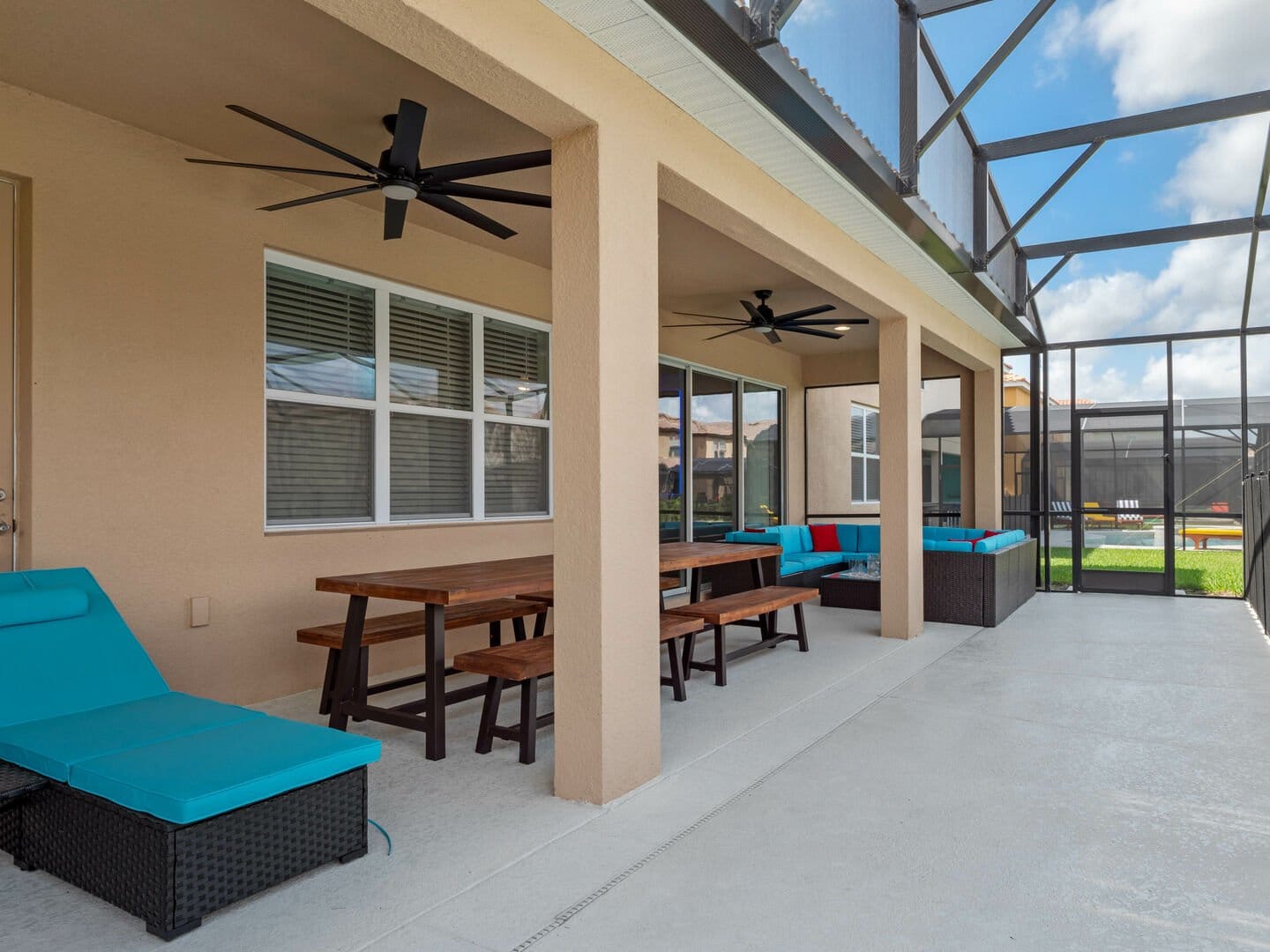 Screened patio with seating area.