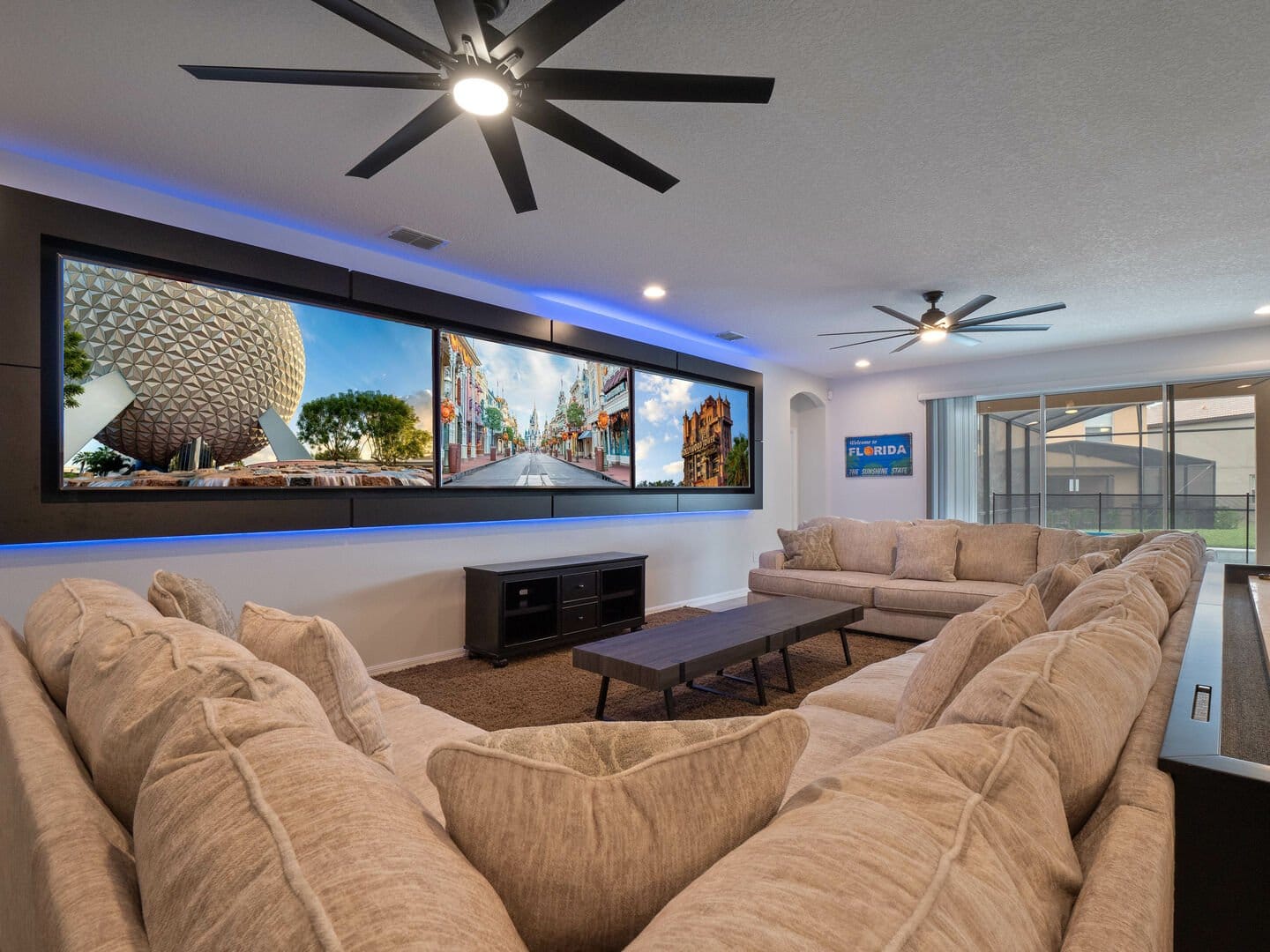 Modern living room with large screen.