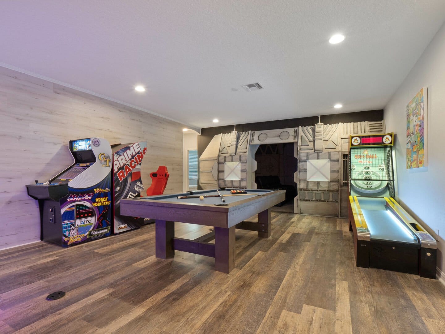 Basement game room with arcade games.