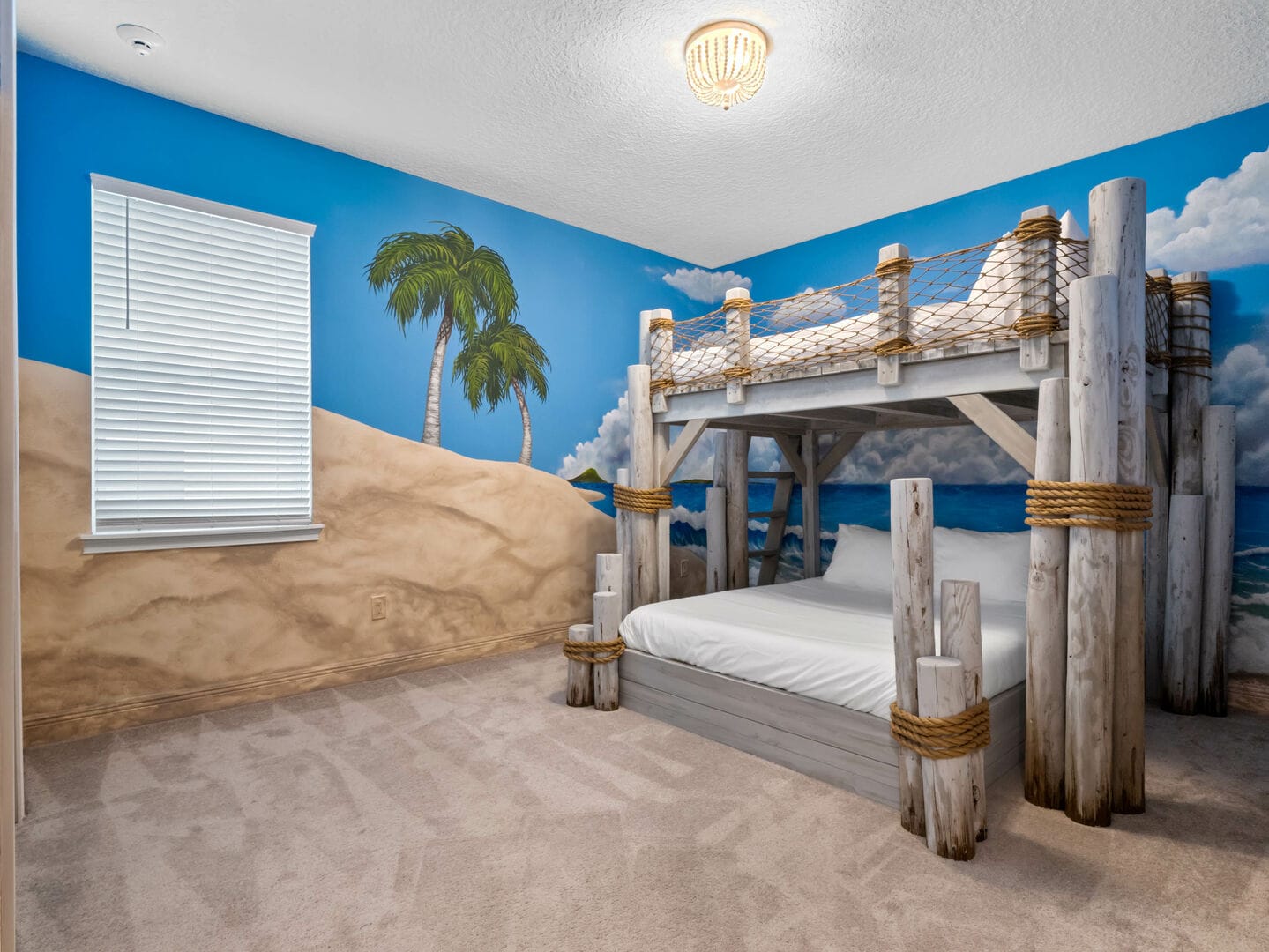 Beach-themed bedroom with bunk beds.