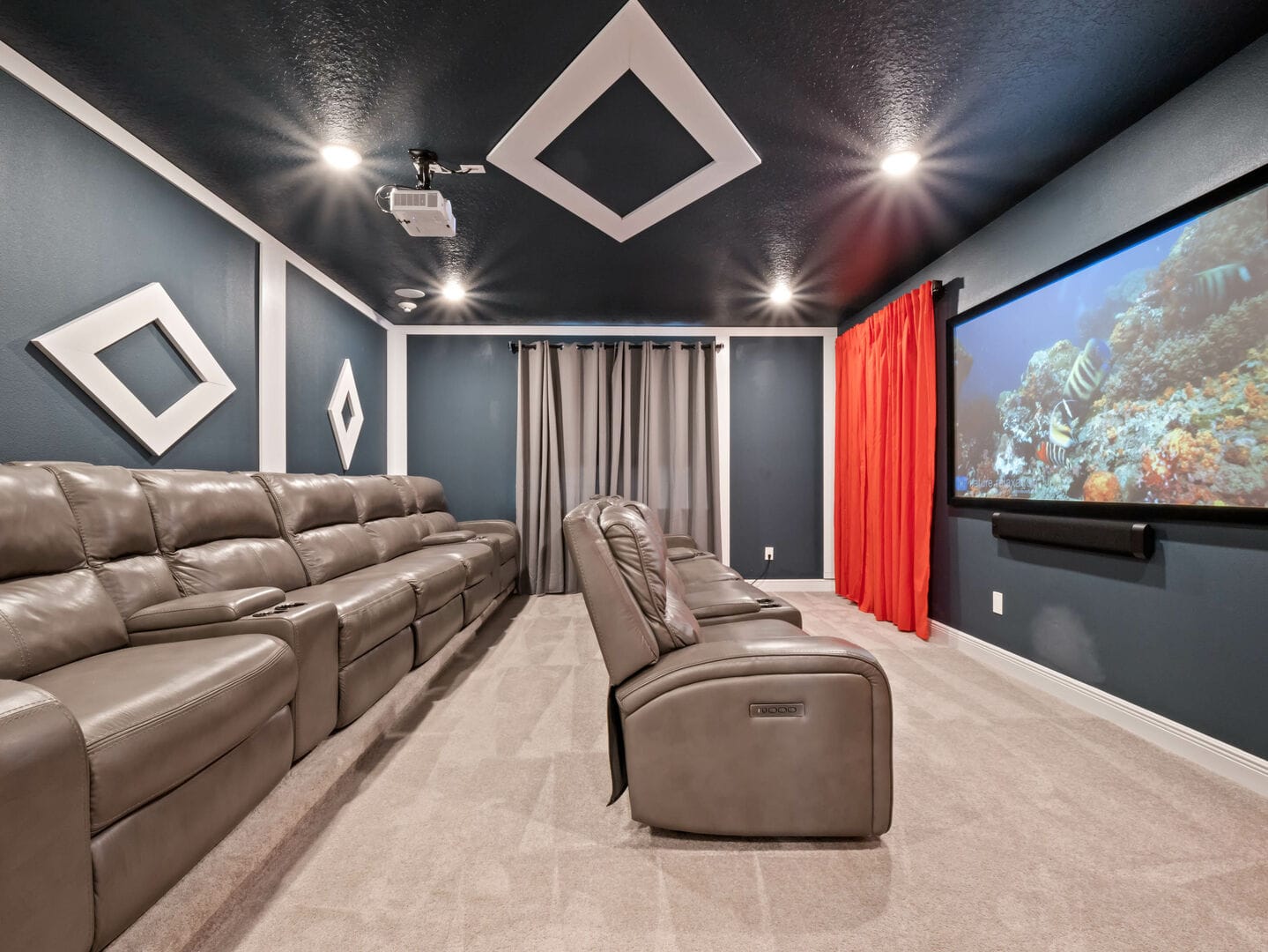 Home theater room with reclining seats.