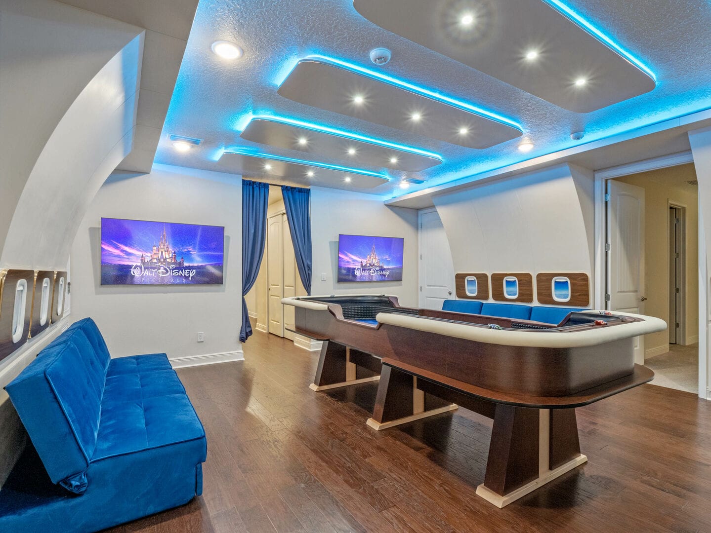 Disney-themed entertainment room with blue lighting.