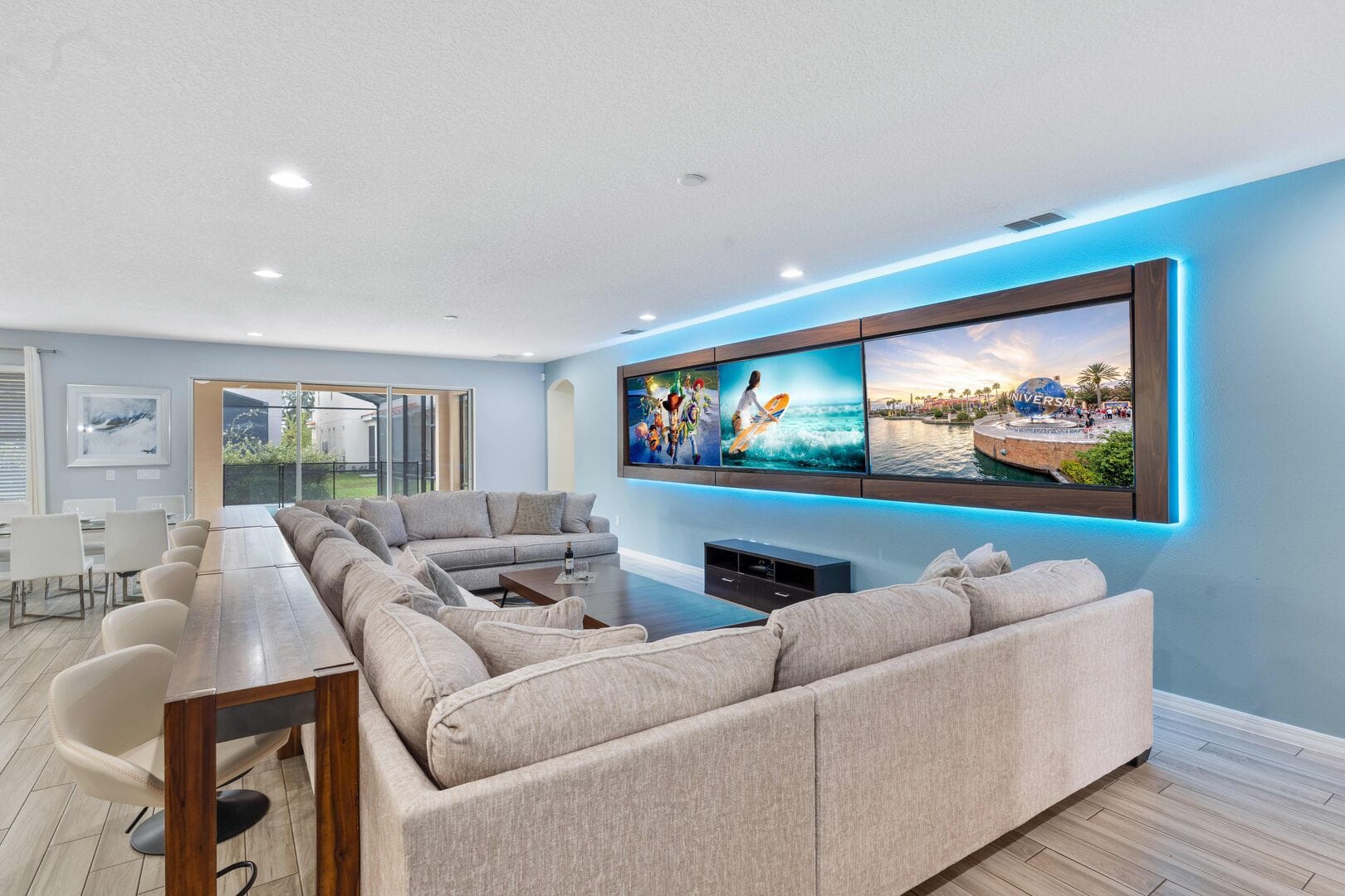 Modern living room with large screen.