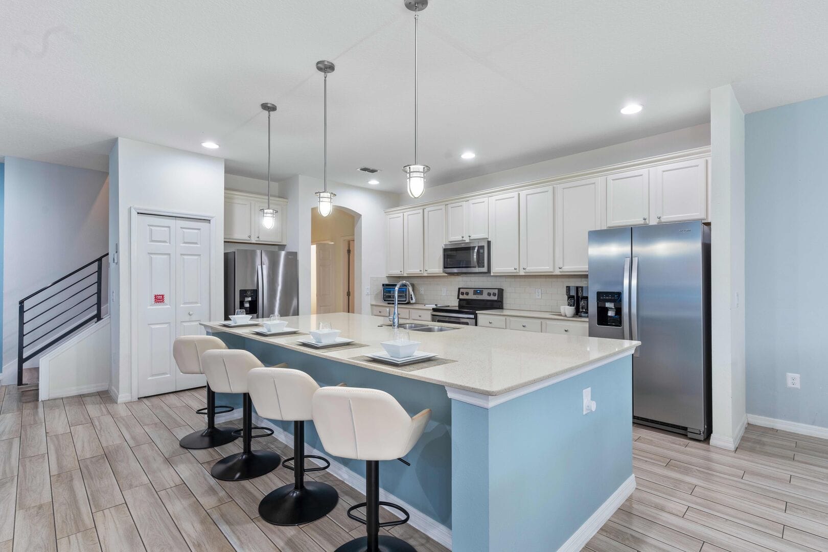 Modern kitchen with bar stools.