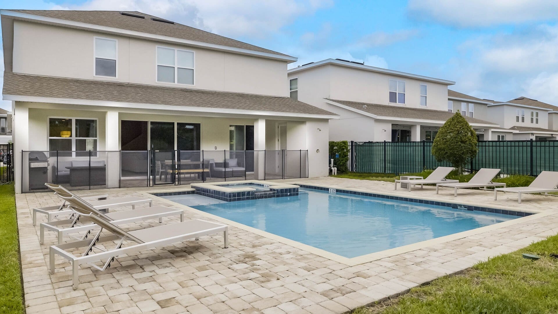 Outdoor pool with lounge chairs.