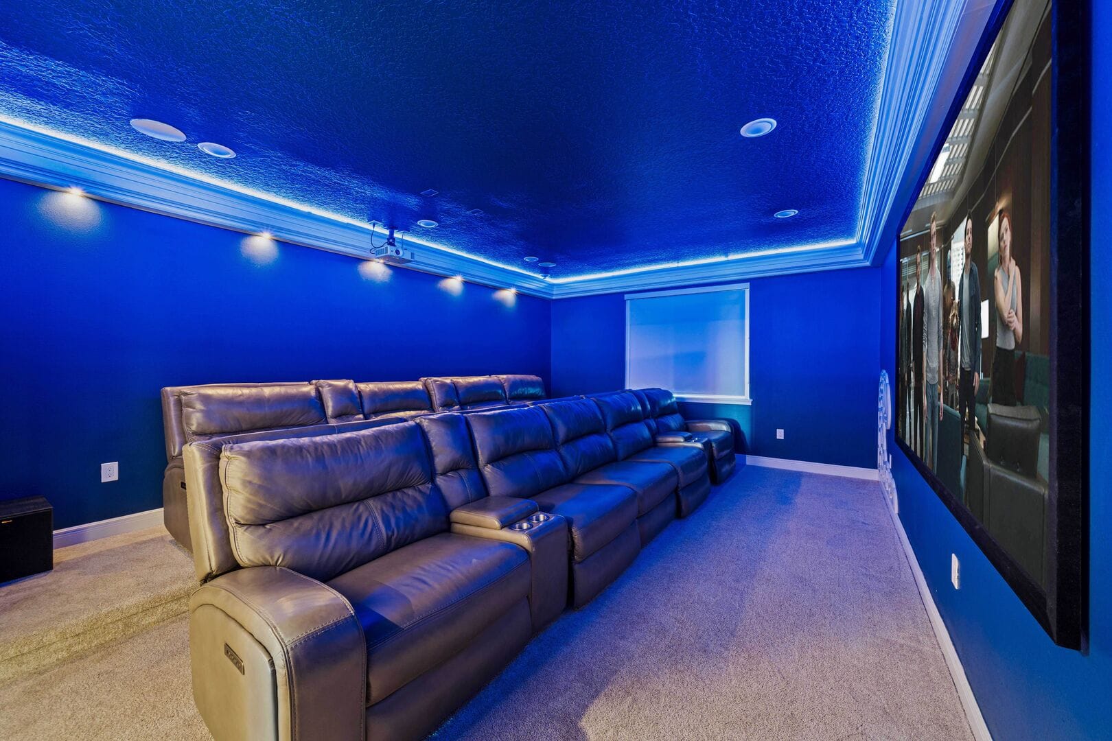 Home theater room with recliner seating.