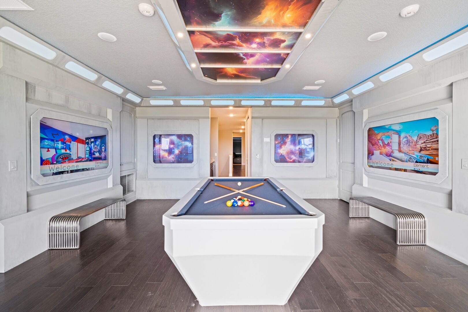 Space-themed room with pool table.