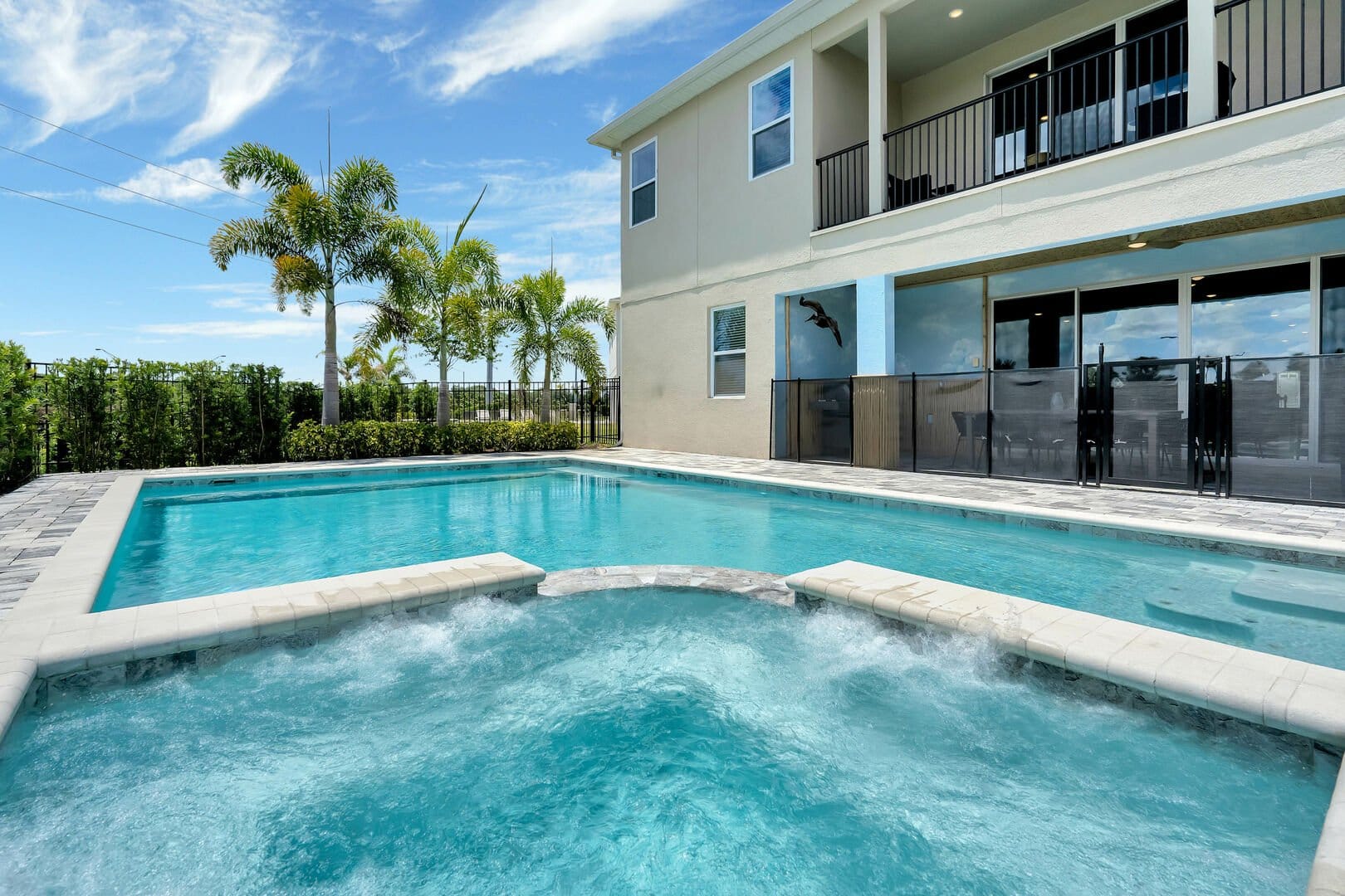 Modern house with palm trees, pool.