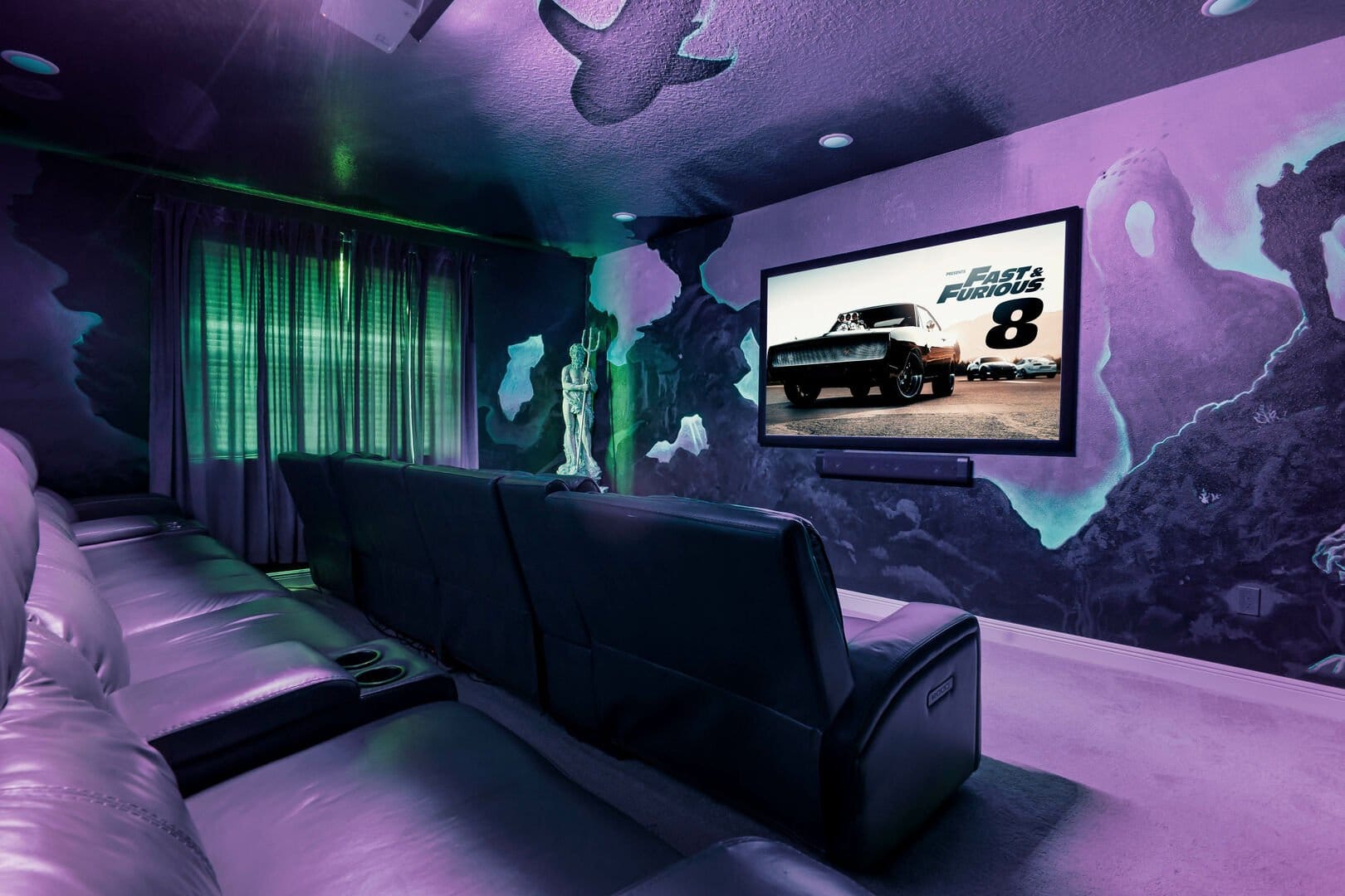 Home theater with purple lighting.